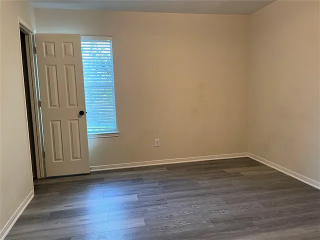 a spacious bathroom with a bathtub sink and mirror