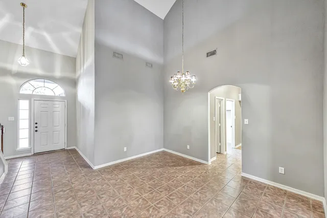 wooden floor in an empty room with a mirror