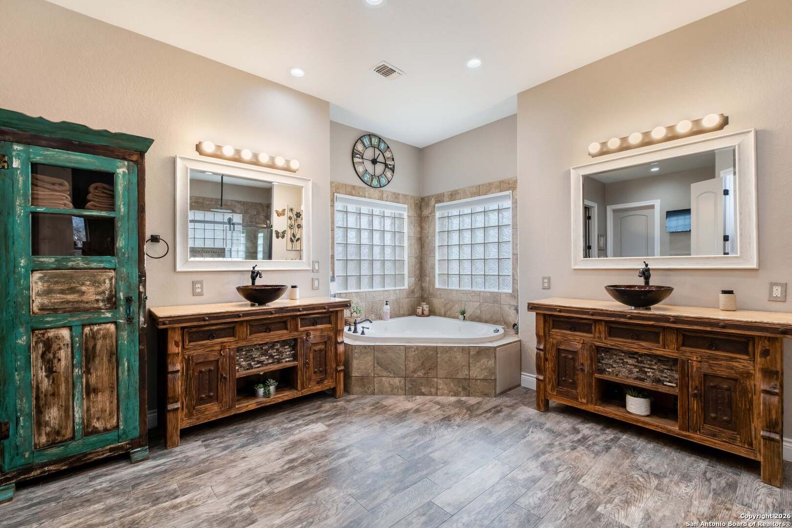 103 Rio Grande Drive Blanco, TX 78606 - Photo 24 of 99 a spacious bathroom with a double vanity sink double mirror and bathtub