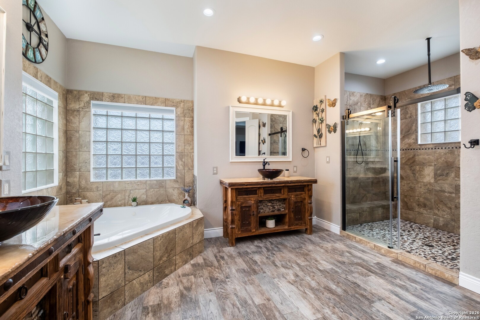103 Rio Grande Drive Blanco, TX 78606 - Photo 25 of 99 a spacious bathroom with a tub sink shower and mirror