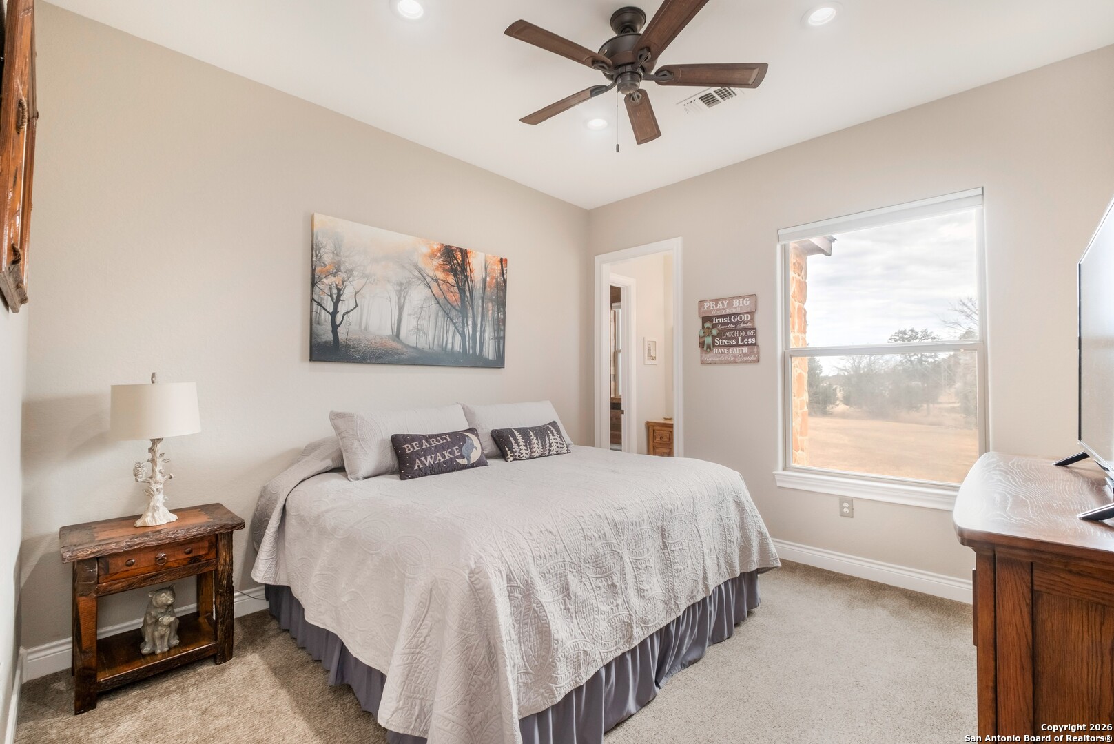 103 Rio Grande Drive Blanco, TX 78606 - Photo 35 of 99 a bedroom with a bed and a window