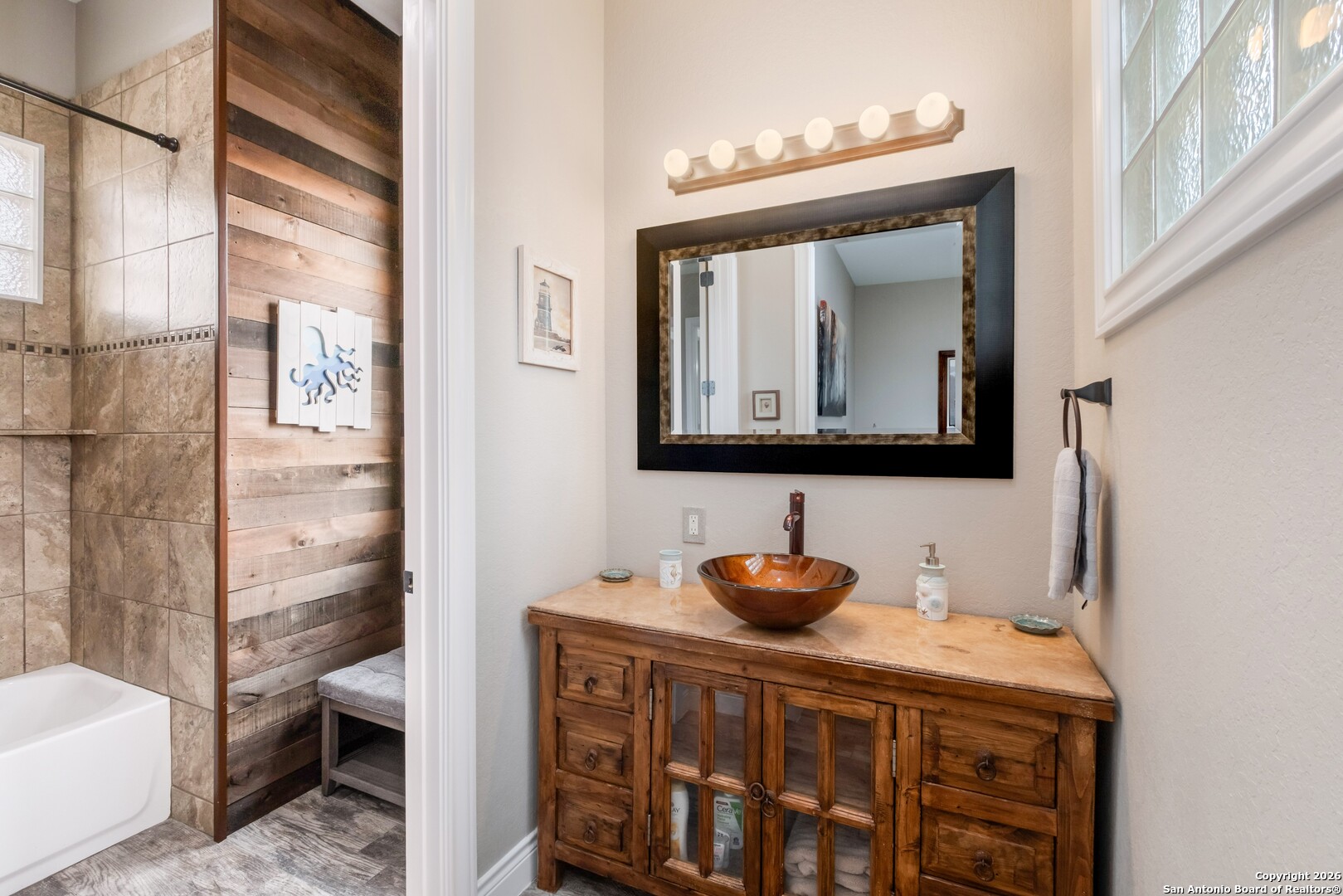 103 Rio Grande Drive Blanco, TX 78606 - Photo 37 of 99 a bathroom with a toilet a sink and a mirror