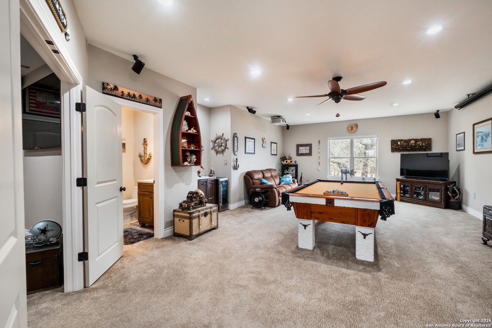 103 Rio Grande Drive Blanco, TX 78606 - Photo 46 of 99 a room with furniture and a flat screen tv