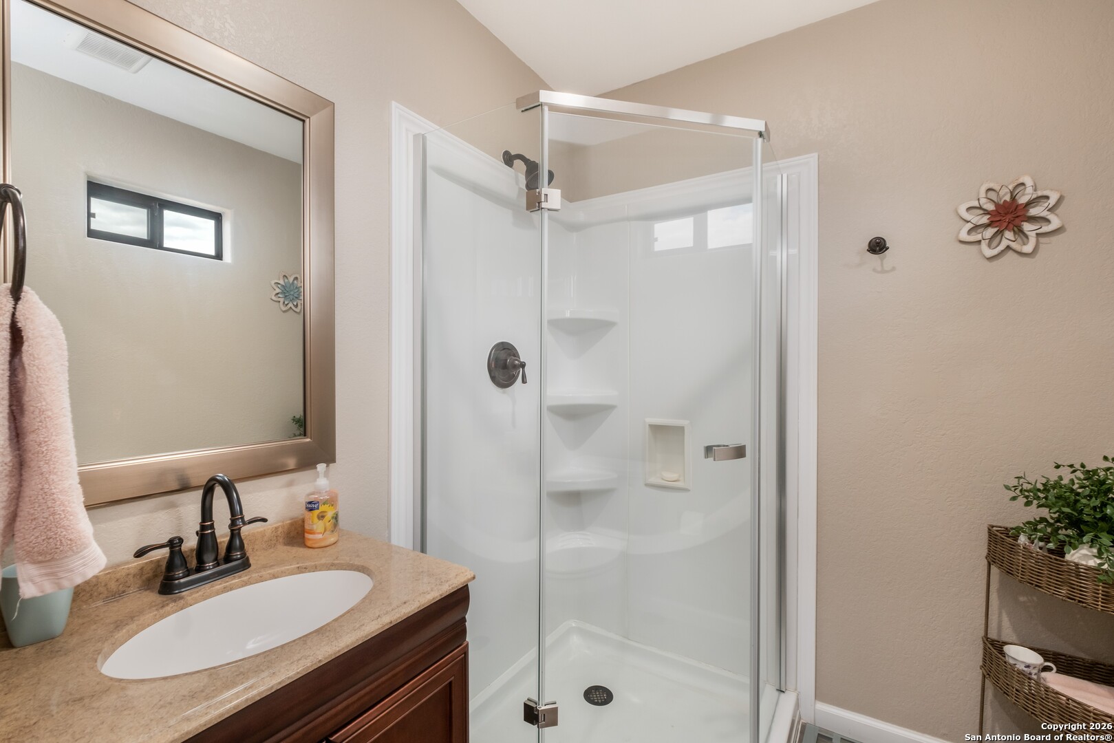 103 Rio Grande Drive Blanco, TX 78606 - Photo 82 of 99 a bathroom with a sink and a mirror