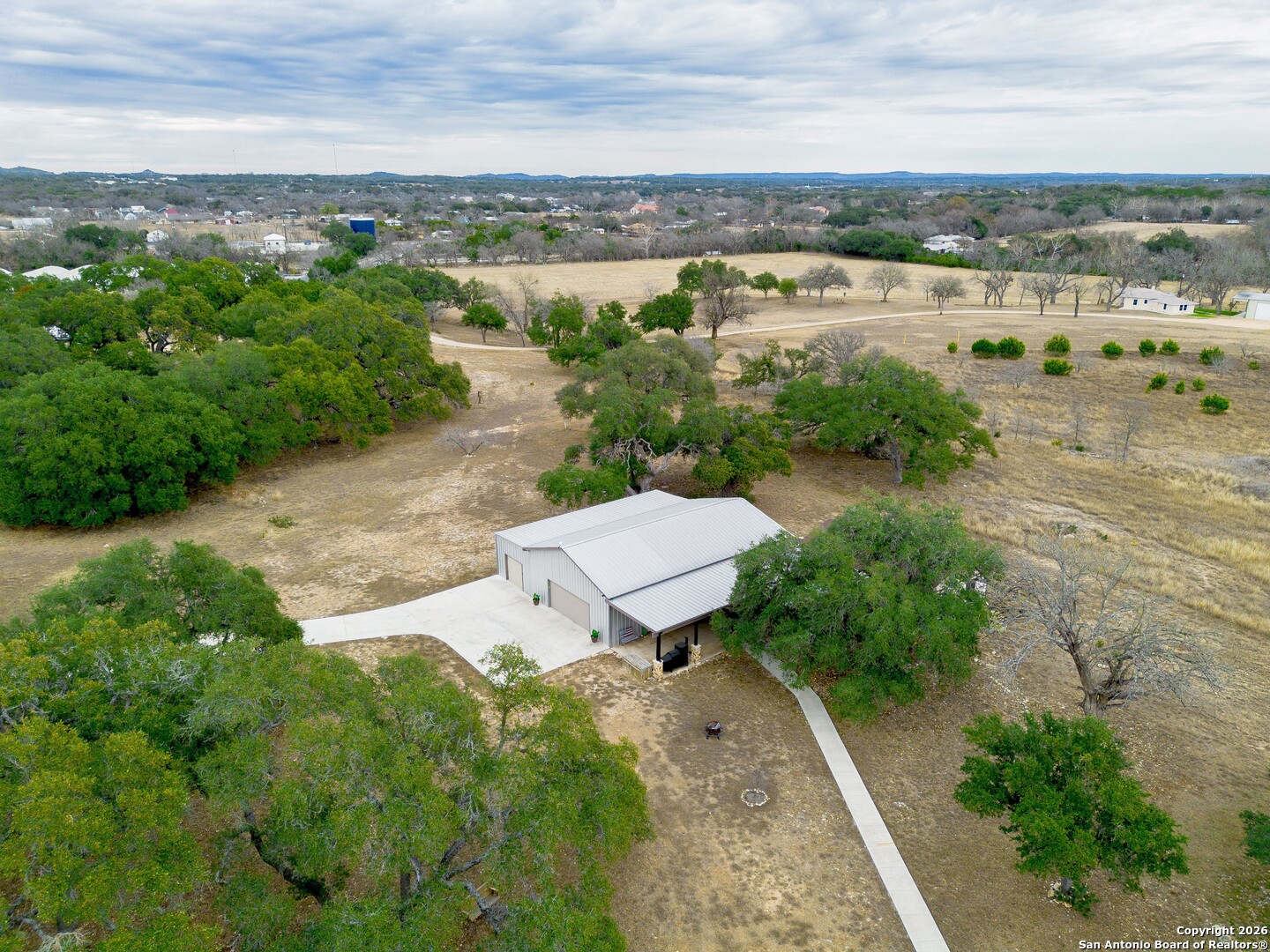 103 Rio Grande Drive Blanco, TX 78606 - Photo 95 of 99 an aerial view of a city with lots of residential buildings ocean and mountain view in back