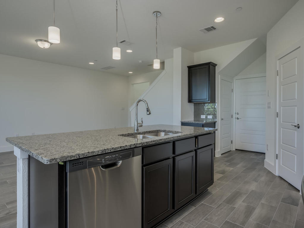 12327 Maypole Bend Austin, TX 78717 - Photo 13 of 30 a bathroom with a granite countertop sink a toilet and a large mirror
