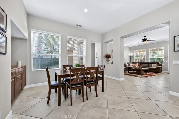 a kitchen with granite countertop stainless steel appliances a stove sink and cabinets