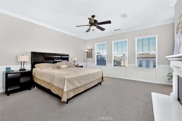 a bed room with a bed and a television