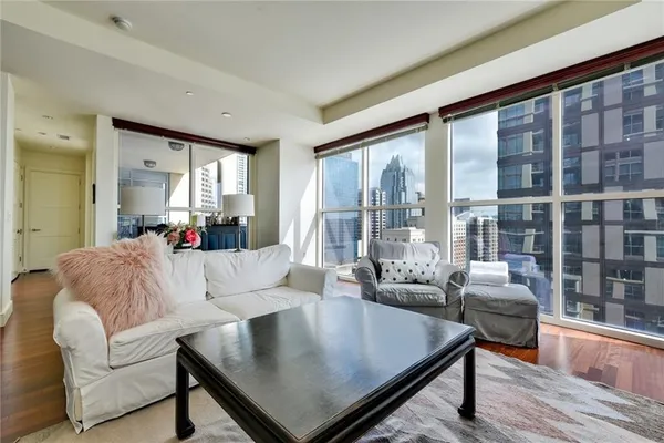 a living room with furniture and a large window
