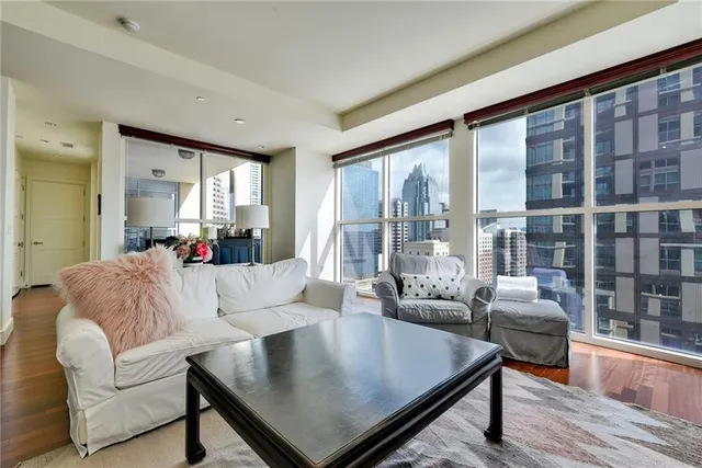 a living room with furniture and a large window