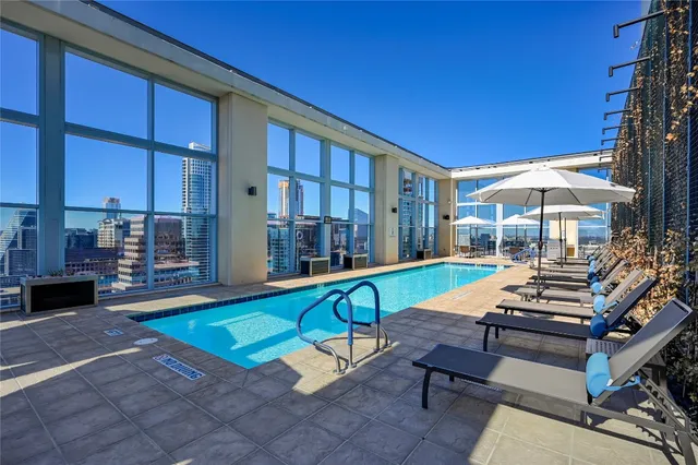a view of a patio with a table and chairs