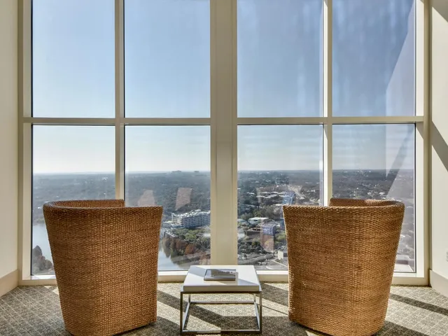 a view of a living room with a table and chair