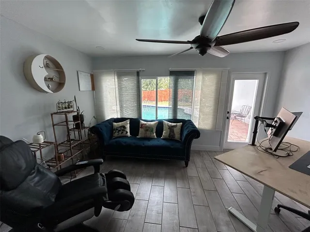 a living room with furniture and a large window