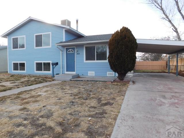1813 Midlothian Road Pueblo, CO 81001 - Photo 1 of 1 a front view of a house with garden