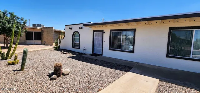 a front view of a house with backyard