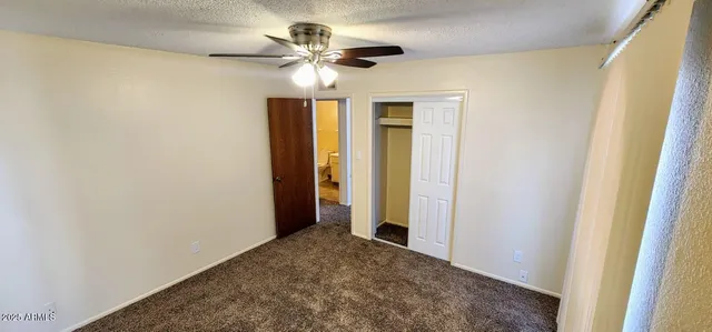 a view of a hallway with a chandelier