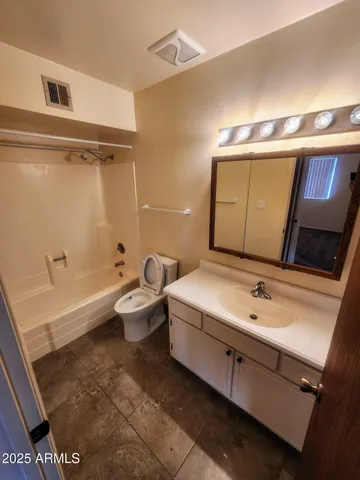 a bathroom with a sink and mirror