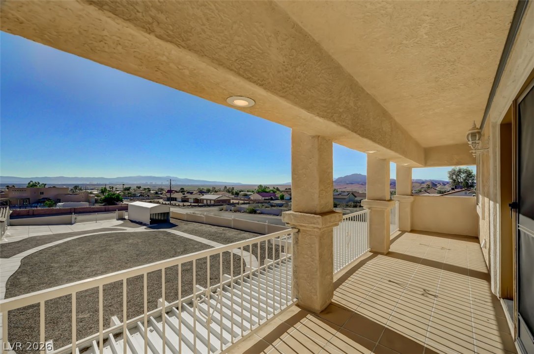 640 North Racetrack Road Henderson, NV 89015 - Photo 65 of 65 An inviting balcony offers expansive views of the distant mountains and surrounding landscape.