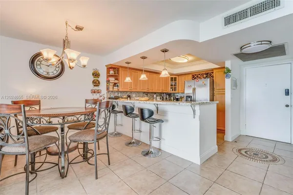 a view of a kitchen and dining room