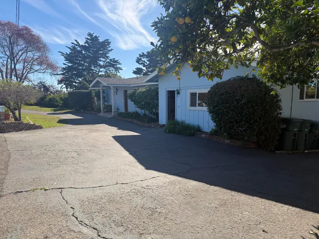 a view of a house with snow on the background