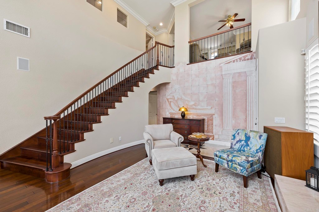 7057 Eider Court Carlsbad, CA 92011 - Photo 13 of 65 a living room with furniture and wooden floor