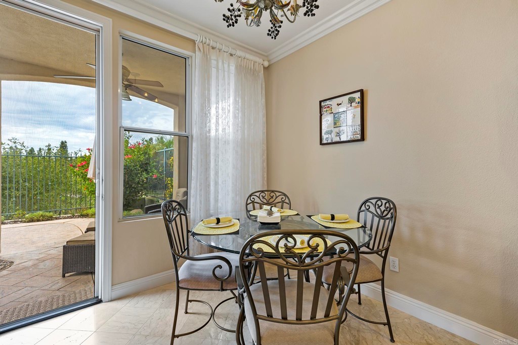 7057 Eider Court Carlsbad, CA 92011 - Photo 24 of 65 a view of a dining room with furniture window and outside view