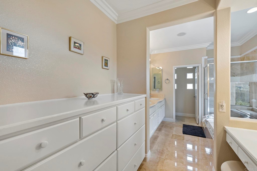7057 Eider Court Carlsbad, CA 92011 - Photo 32 of 65 a spacious bathroom with a tub sink and mirror