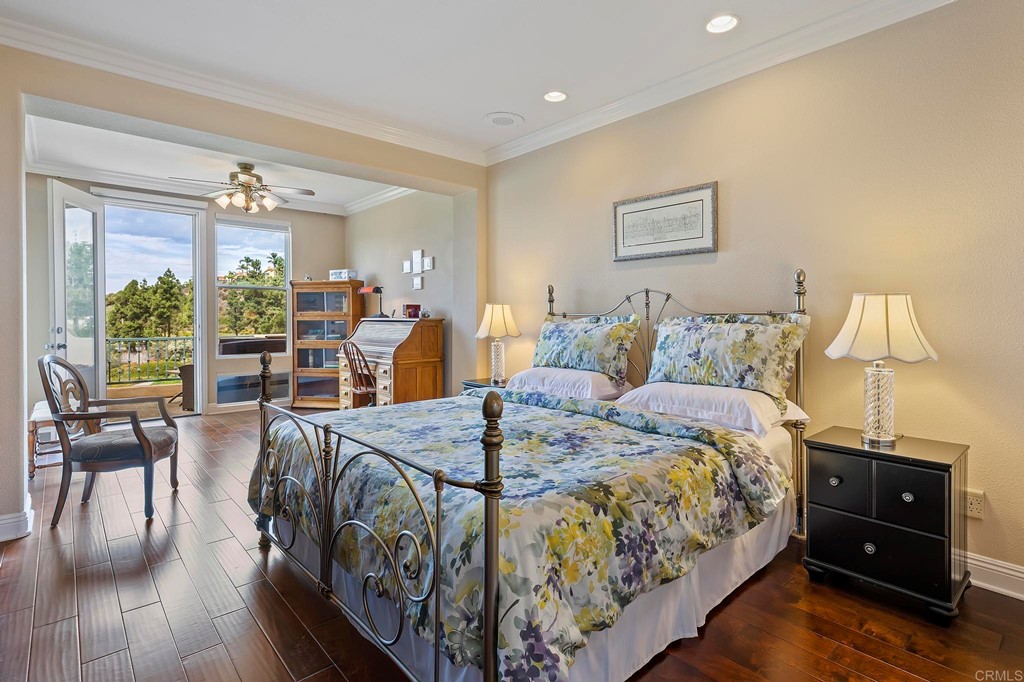 7057 Eider Court Carlsbad, CA 92011 - Photo 42 of 65 a bed room with a bed and a tv