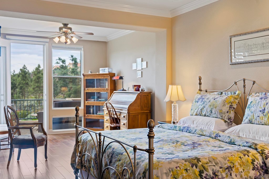 7057 Eider Court Carlsbad, CA 92011 - Photo 43 of 65 a bedroom with furniture and a large window