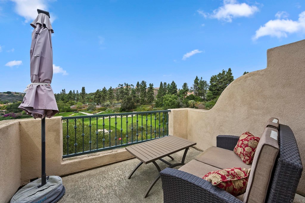 7057 Eider Court Carlsbad, CA 92011 - Photo 52 of 65 a view of a terrace with couches and wooden floor