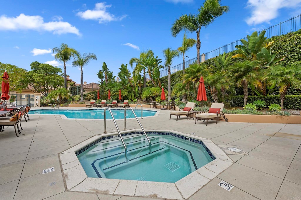7057 Eider Court Carlsbad, CA 92011 - Photo 63 of 65 a view of a swimming pool with a patio