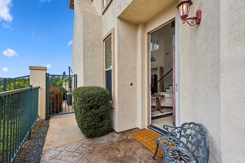 7057 Eider Court Carlsbad, CA 92011 - Photo 8 of 65 a view of a entryway door of the house
