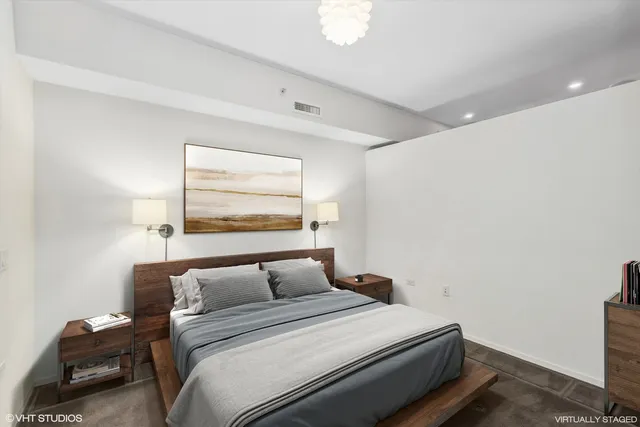 a bedroom with a bed and window