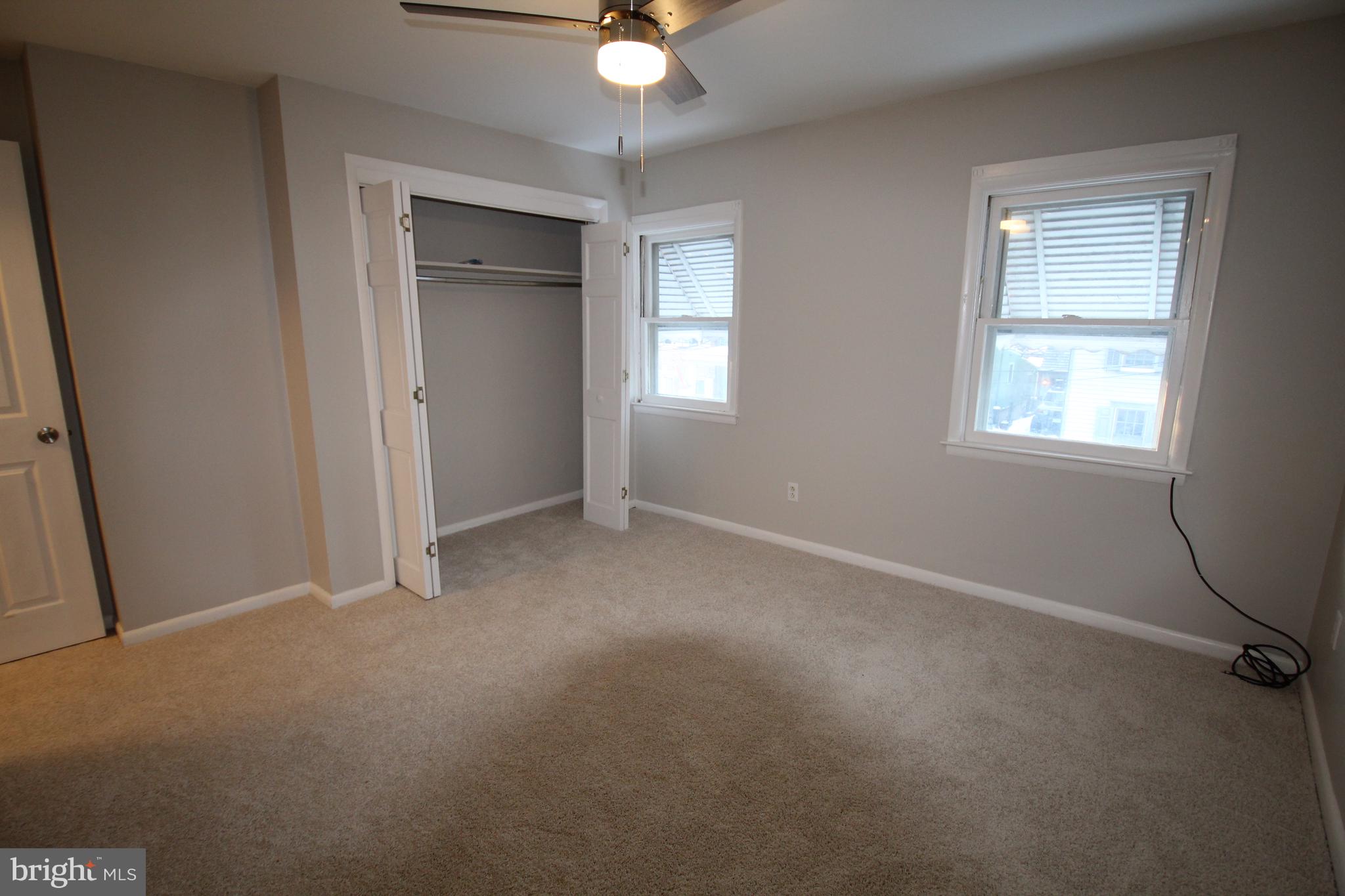 25 East 4th Street New Castle, DE 19720 - Photo 13 of 22 an empty room with windows and fan