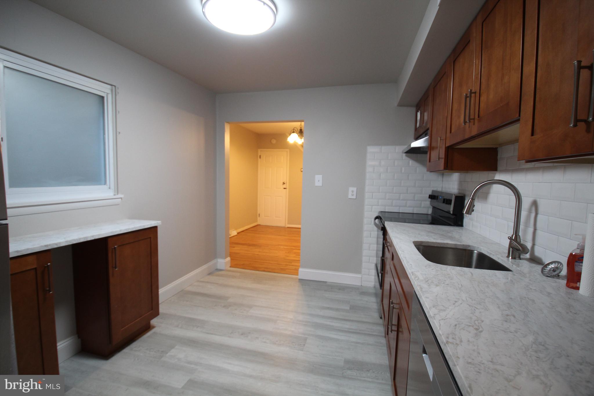 25 East 4th Street New Castle, DE 19720 - Photo 9 of 22 a kitchen with sink and cabinets