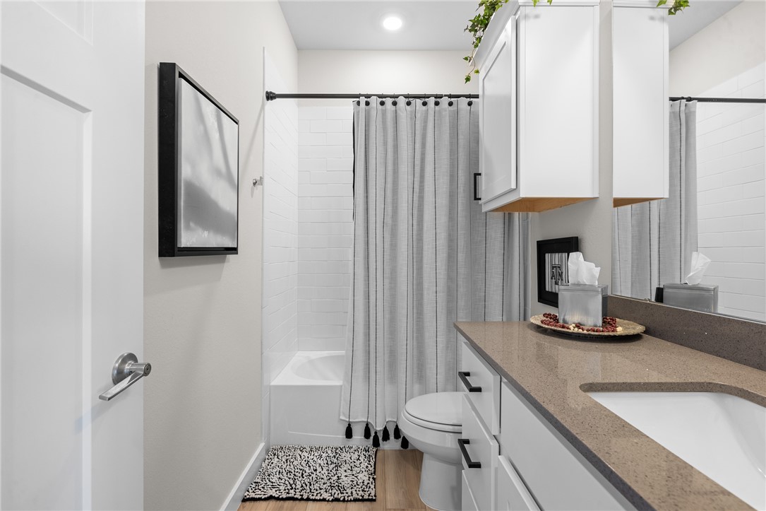 767 Double Mountain Road College Station, TX 77845 - Photo 13 of 34 a bathroom with a sink toilet and shower