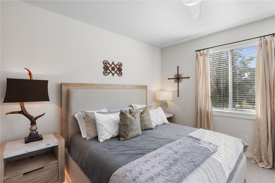 767 Double Mountain Road College Station, TX 77845 - Photo 21 of 34 a bedroom with bed and a window