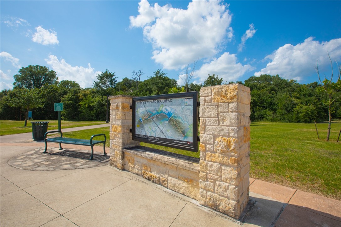 767 Double Mountain Road College Station, TX 77845 - Photo 34 of 34 a park view with a bench and floor to ceiling window and garden