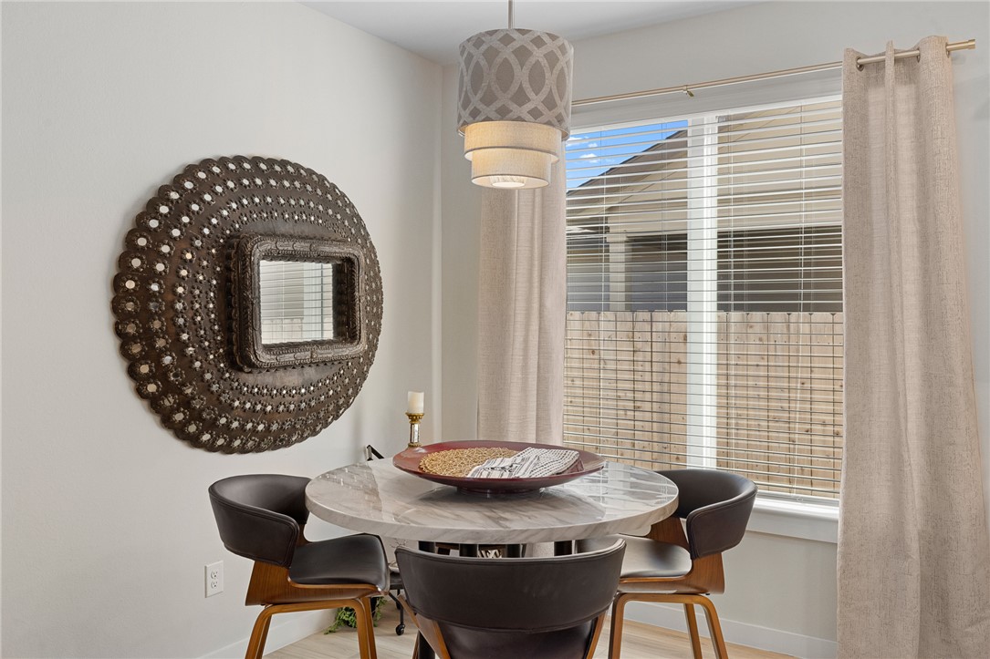 767 Double Mountain Road College Station, TX 77845 - Photo 10 of 34 a view of a dining room with furniture and window