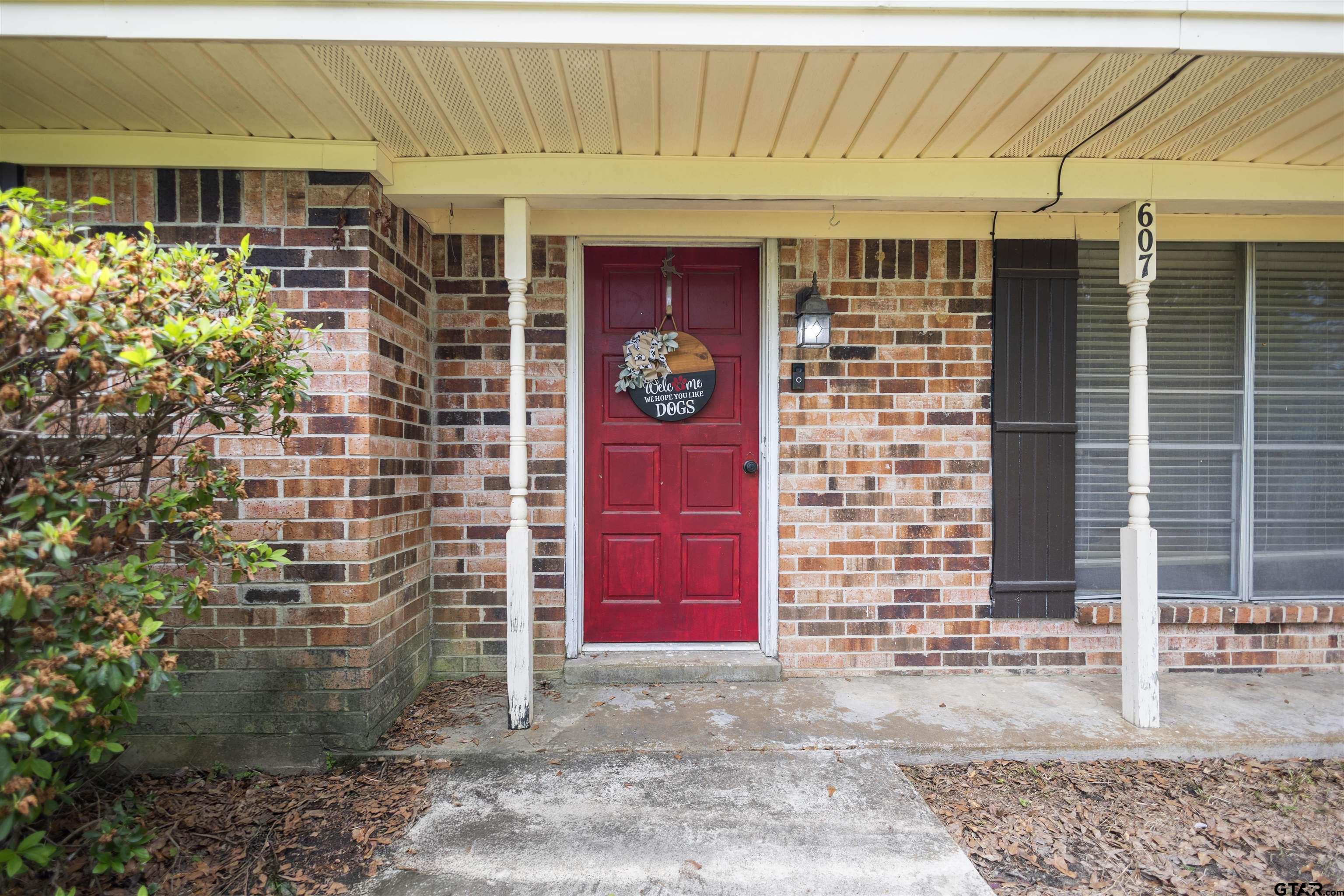607 Beverly Drive Carthage, TX 75633 - Photo 7 of 11 a front view of a house with a garage