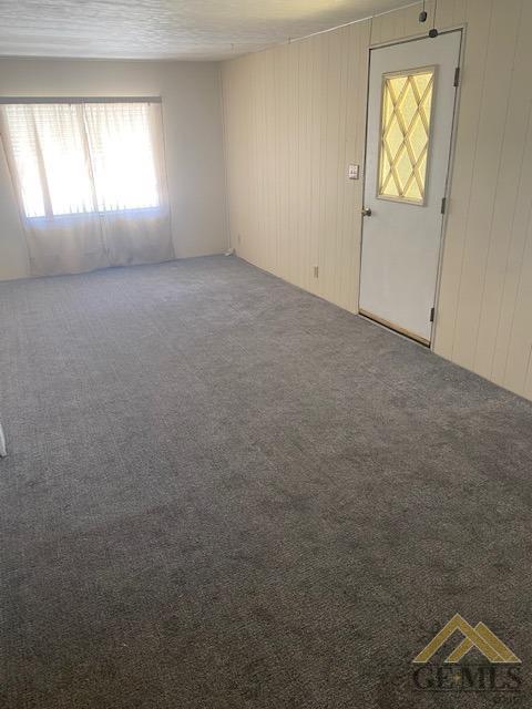 Undisclosed Address Bakersfield, CA 93307 - Photo 2 of 11 an empty room with windows