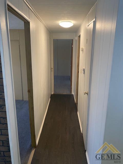 Undisclosed Address Bakersfield, CA 93307 - Photo 3 of 11 a view of hallway with stairs