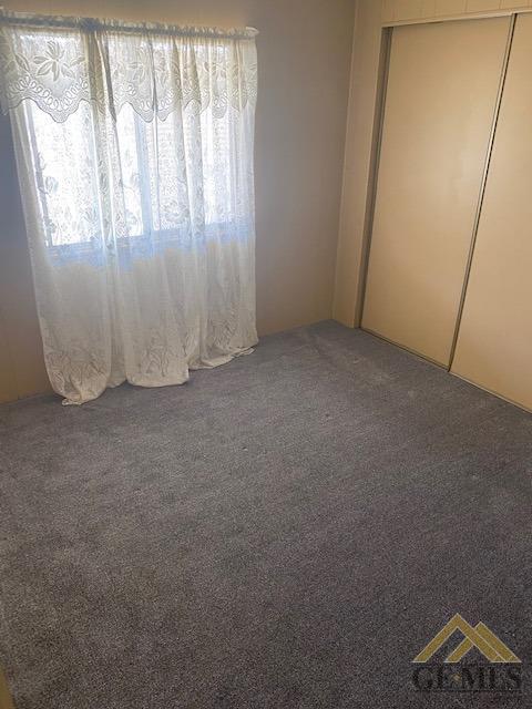 Undisclosed Address Bakersfield, CA 93307 - Photo 4 of 11 an empty room with windows