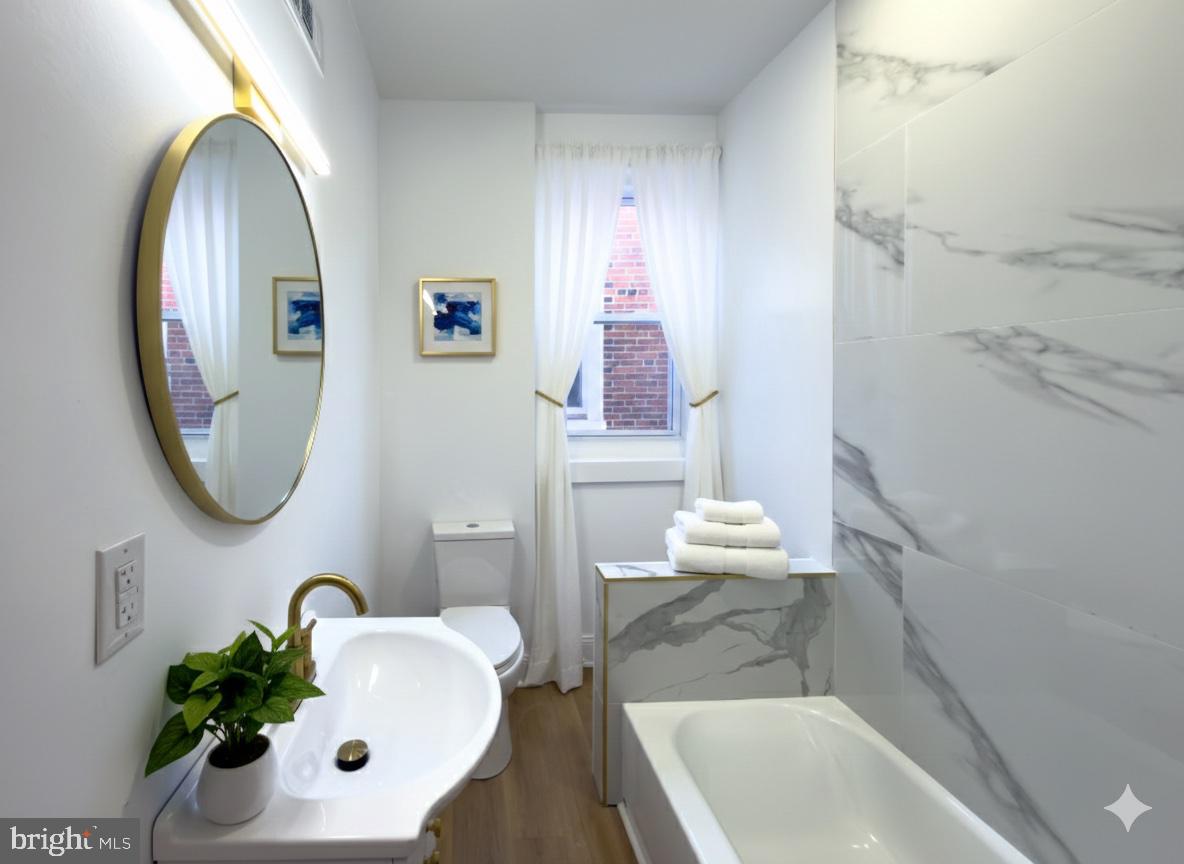 5237 Greenway Avenue Philadelphia, PA 19143 - Photo 18 of 28 Virtually Staged Full Bathroom Upstairs