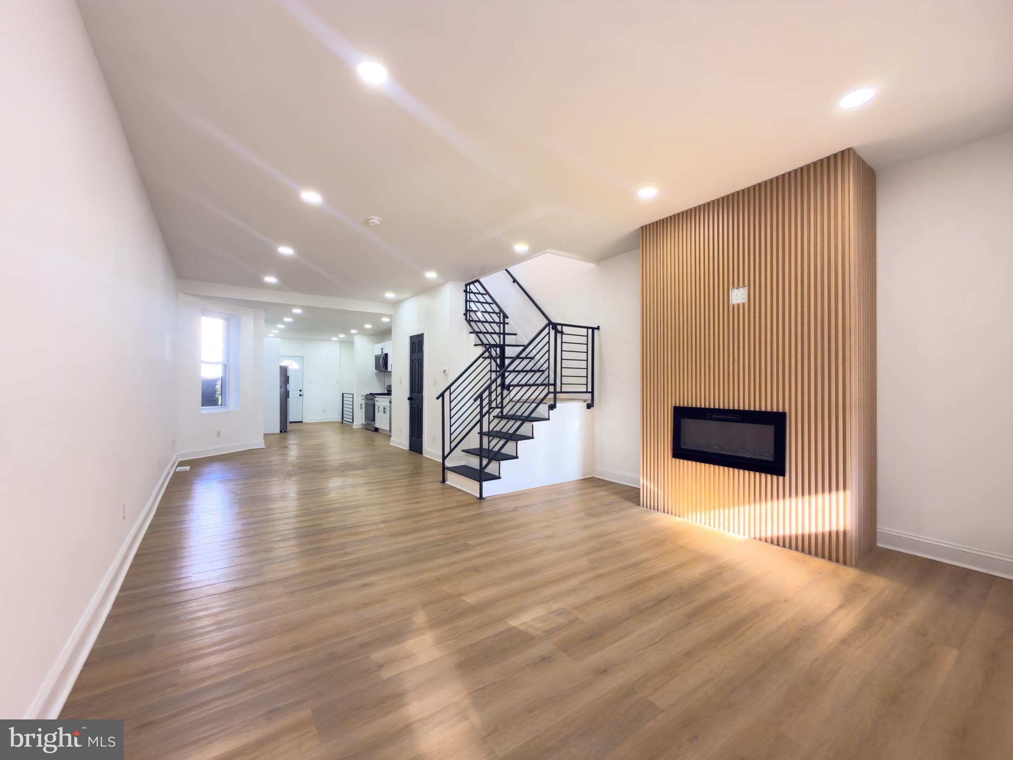 5237 Greenway Avenue Philadelphia, PA 19143 - Photo 2 of 28 Living/ Dining Room with fire place.