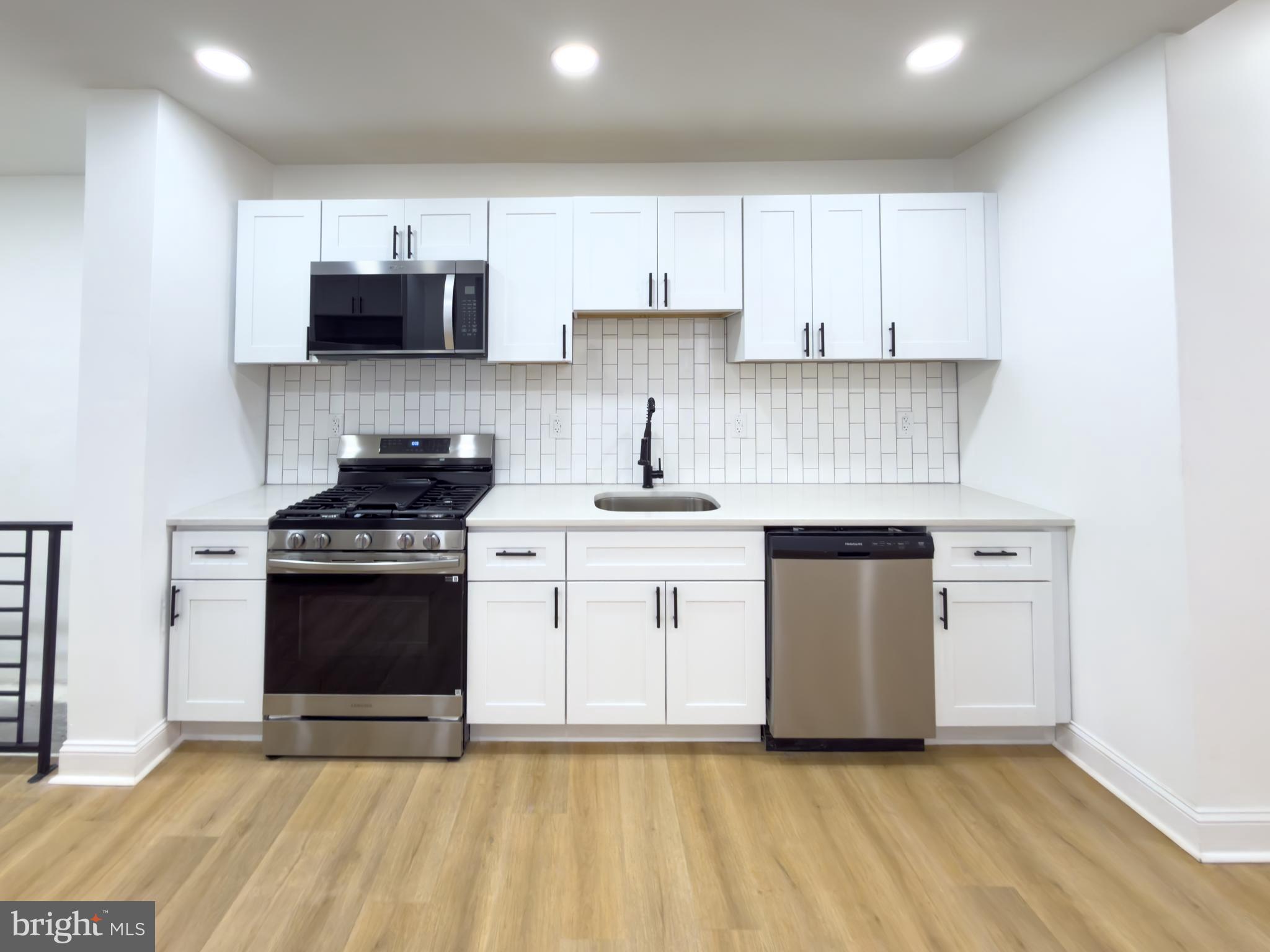5237 Greenway Avenue Philadelphia, PA 19143 - Photo 8 of 28 Kitchen with all new stainless steel appliances.