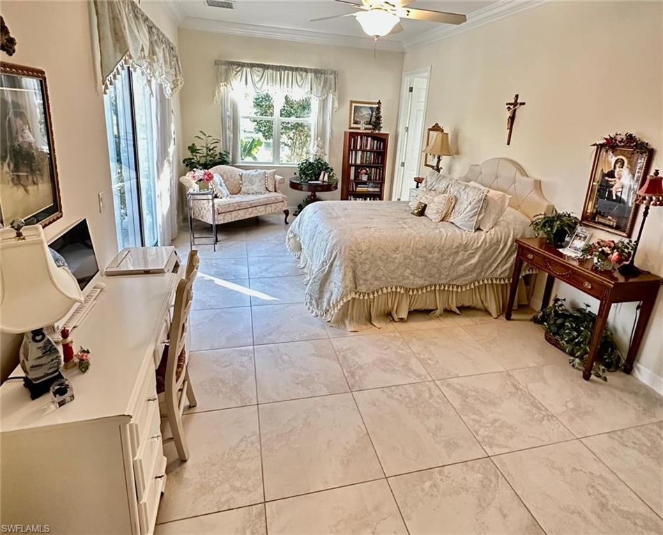 5220 Milano Street Ave Maria, FL 34142 - Photo 13 of 27 Bedroom featuring crown molding, access to exterior, and a ceiling fan