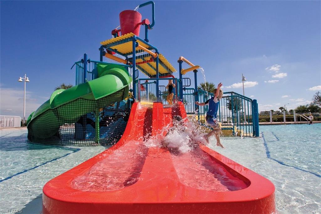 5220 Milano Street Ave Maria, FL 34142 - Photo 19 of 27 a swimming pool with a outdoor seating and yard