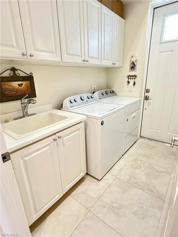5220 Milano Street Ave Maria, FL 34142 - Photo 2 of 27 Laundry area with cabinet space and independent washer and dryer