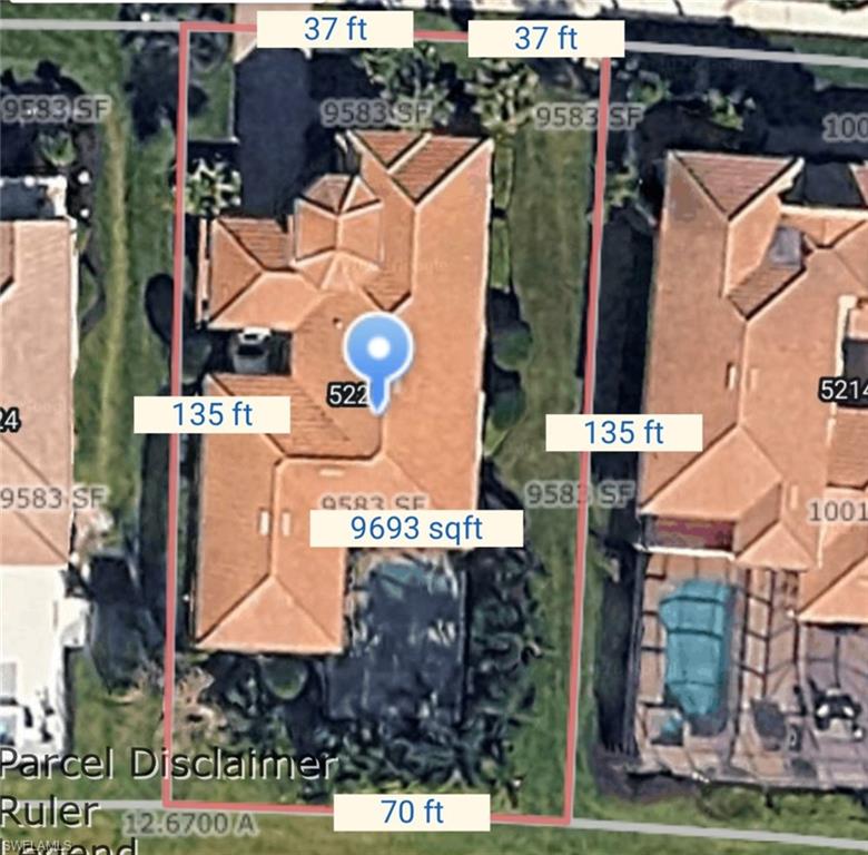 5220 Milano Street Ave Maria, FL 34142 - Photo 25 of 27 an aerial view of residential houses with outdoor space and parking